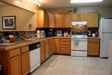 Interior photos are of the model unit, but same fl