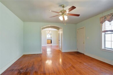 Front entrance into the living room.  Real wood fl