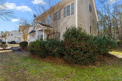 View of side of property with a lawn