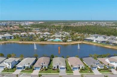 Aerial view showing the home location with a lake