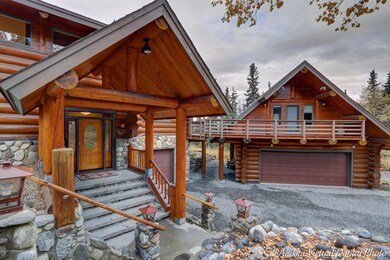 Welcoming rock & log covered entry
