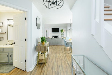 Hall featuring a chandelier and light wood finished floors