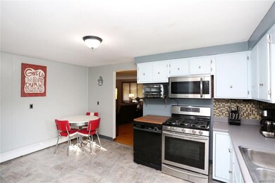 Brand new tile floor in eat-in kitchen