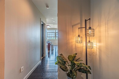 Corridor featuring dark hardwood / wood-style floo