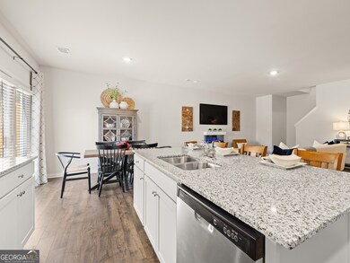 sudbury townhome kitchen with white cabinets and granite countertops at mountain park in dahlonega georgia