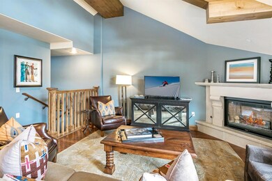 Main living room with a fireplace and va