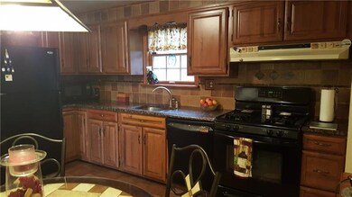 Updated eat-in kitchen features granite counters a
