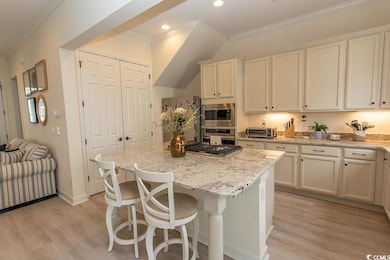 Kitchen featuring stainless steel appliances, ligh