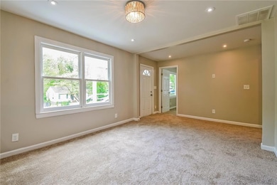 Empty room with recessed lighting, carpet, visible