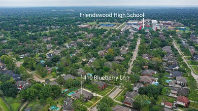 This aerial shot shows that this gorgeous home is situated on a lot in close proximity to Friendswood High School! You can walk to the school and indoor pool with public access!