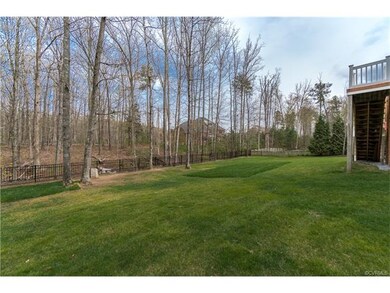 Huge private fenced rear yard backing up to natura