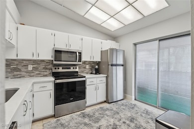 Kitchen with appliances with stainless steel finis