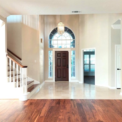 Marbled floor Foyer and entry to office.