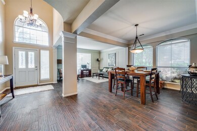 An open floor plan welcomes you with a living and 