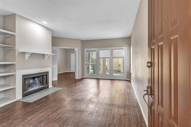 Unfurnished living room with wood-type flooring an