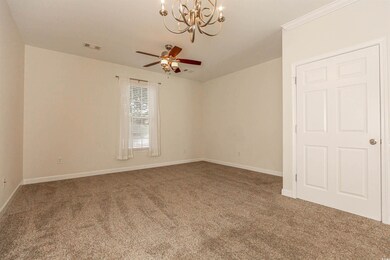 Spare room featuring ceiling fan with notable chan