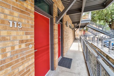 Doorway to property featuring brick siding