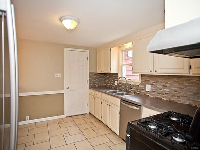Spacious kitchen w/ tiled floor and easy access to