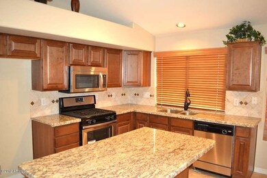 Maple Cabinet and SS Appliances