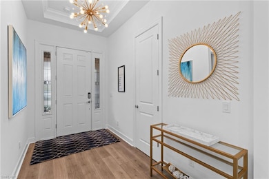 Entrance foyer with crown molding, baseboards, a c
