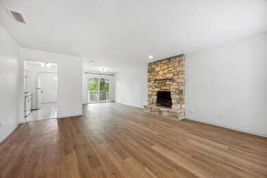Unfurnished living room featuring light wood-styl