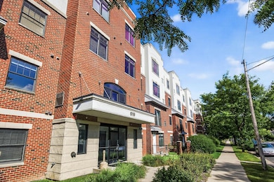 Charming brick exterior welcomes you to this modern condo community, just steps from shops, dining, and transit