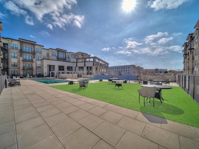 View of home's community featuring a yard, a swimm