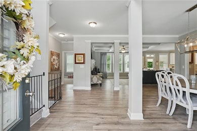 Entryway featuring ornamental molding, a ceiling f