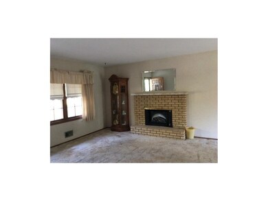 Living room is light and bright - hardwoods under 