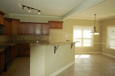 Large kitchen with island and eat in area, large enough to even have a play area for the children, if desired.