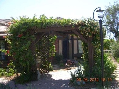 Beautiful Flowery Arbor with lamp embraces the ent