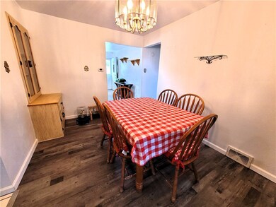 Dining room with newer LVP Flooring & built-in hut