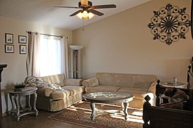 2nd view of living room area with vaulted ceilings