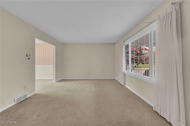Spacious living room with tons of natural light!