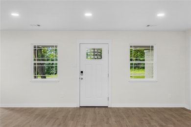 Entrance foyer with wood finished floors, healthy
