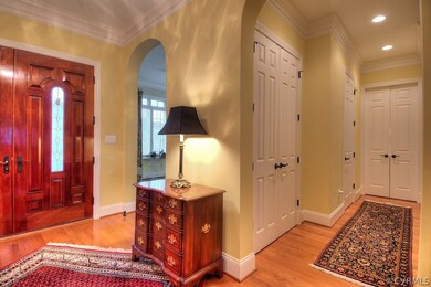 Open foyer with lovely hardwood floors.