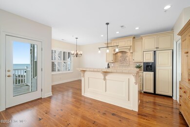 Kitchen w/ island seating & dining space