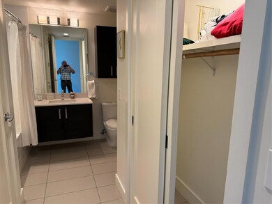 Ensuite bathroom with tile patterned flooring, to