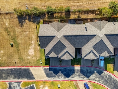 Aerial view of property and surrounding area with property parcel outlined