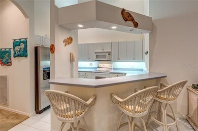 Eat at kitchen counter that is open to dining room