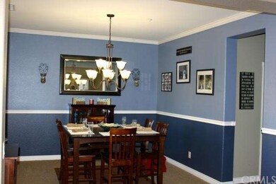 Large formal dining room with new chandelier, chai