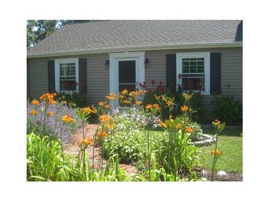 Exterior Front. Beautiful perennials  in the sprin