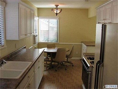 Kitchen also has dining area and breakfast bar, bo