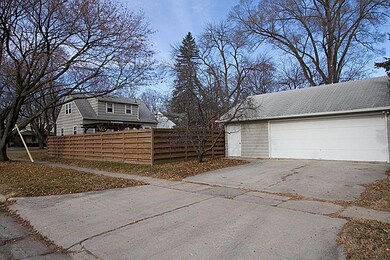 Fenced yard with garden and 2 car garage