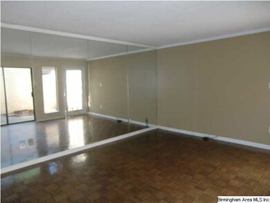 Mirrored wall in living room makes room extra brig