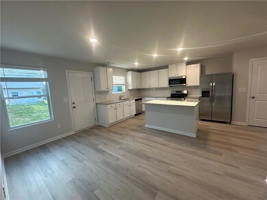 Kitchen with appliances with stainless steel finis