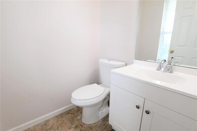 Half bath, main floor as soon as you enter home on