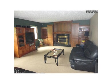 Large family room with wood burning fireplace with