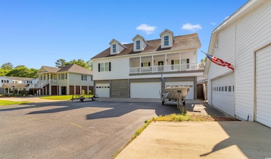 View of front of property featuring a shingled roo