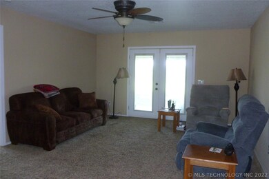 LIVING AREA WITH DOORS OUT TO COVERED PATIO